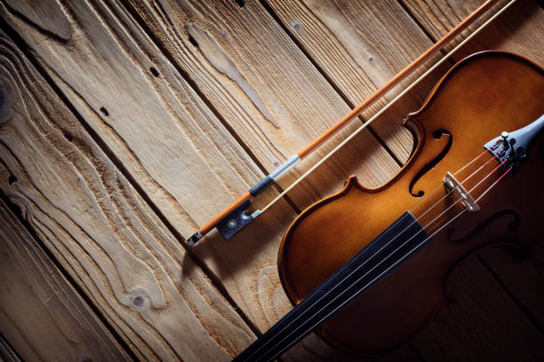 istock Violin on wood background with copy space for music concept 1302953531