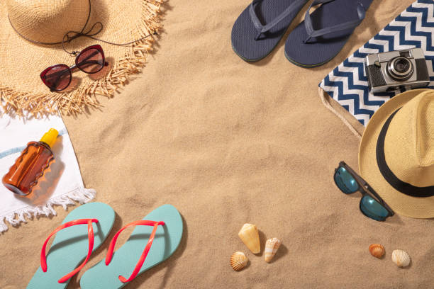 istock Couple beach accessories on the sand with copy space 1302955838