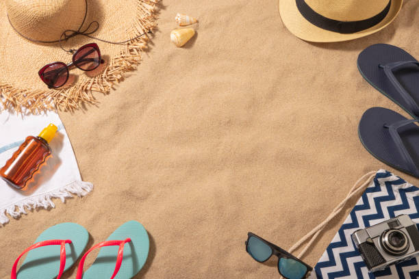 istock Couple beach accessories on the sand with copy space 1302956494