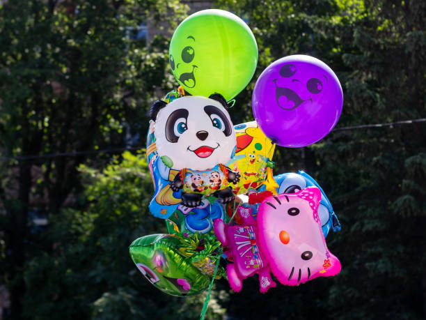 Close-up of a balloon, with lots of balloons as party decoration in the background.
