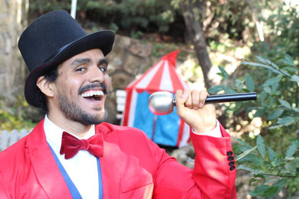 Announcer holding microphone in the circus.