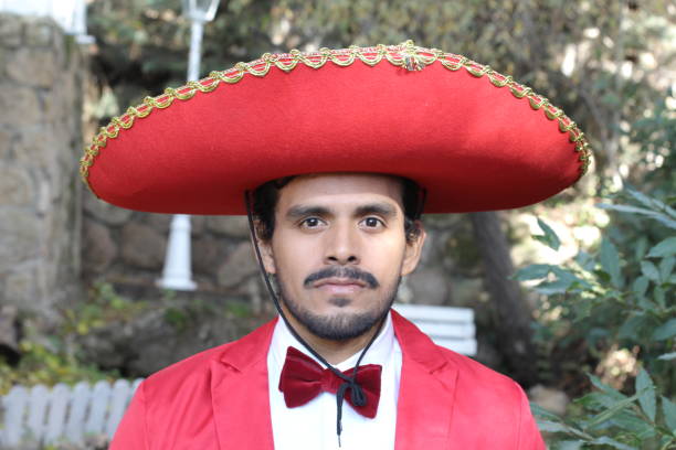 istock Traditional mexican man with elegant red outfit 1302966733