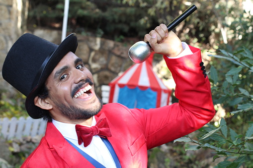 Announcer holding microphone in the circus.