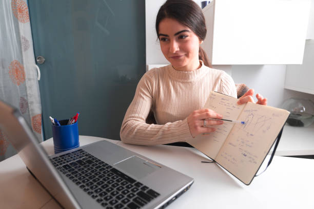 istock Young woman working with a laptop 1302966919