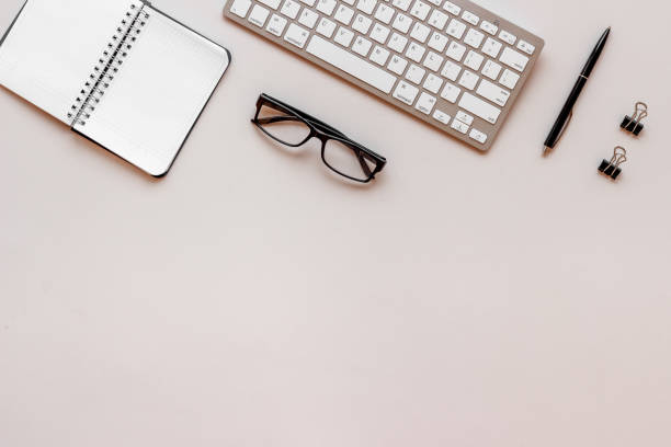 istock Minimalism workplace at office or home. Flat lay desktop with keyboard 1302967071