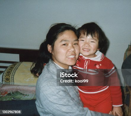 istock 1980s China Little Girl and Mother Old Photos of Real Life 1302967808