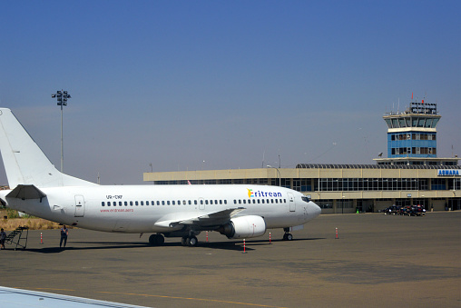 Asmara, Eritrea: Eritrean Airlines Boeing 737-3Z0 MSN 27126 UR-CNF (Ukraine registration) ,main terminal and air traffic control tower, apron view - Eritrean (B8), is the national airline of Eritrea, wholly government owned - Asmara International Airport, former Aeroporto di Gura.