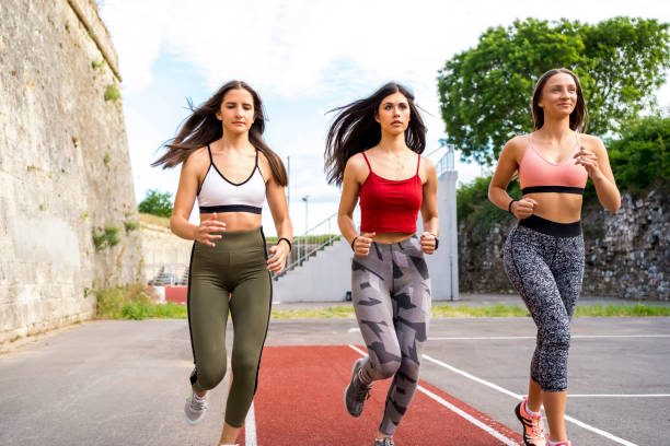 istock Sporty women running together 1302971224