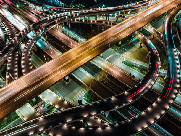 istock Aerial view of highway junction at night 1302973353