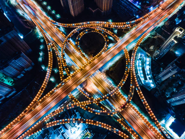 istock Aerial View City Overpass Road At Night 1302973980