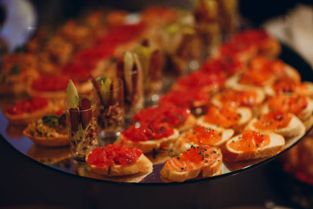istock snacks bruschetta sandwiches with fish and vegetables on the table catering 1302975054