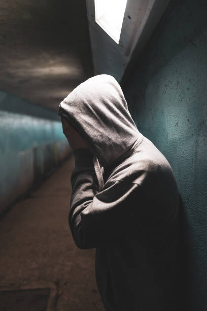 istock Depressed man with hands over face in despair 1302975567