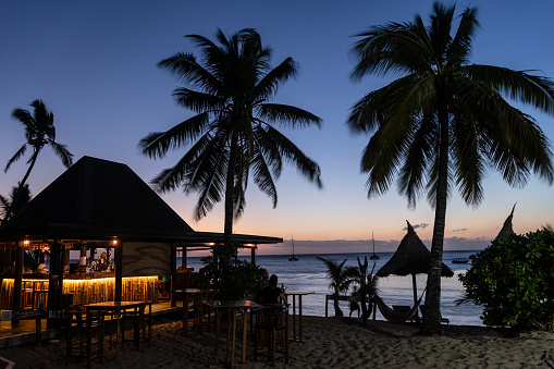 Twilight over a beach bar in the Waya island, part of the Yasawa group, in Fiji in the south Pacific ocean