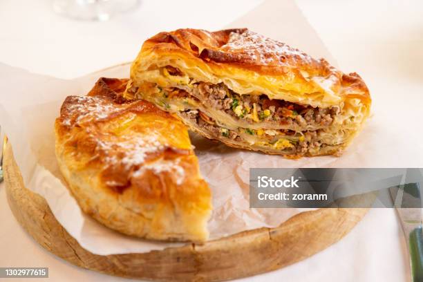 Burek With Minced Meat And Other Ingredients Cut In Half Stock Photo - Download Image Now