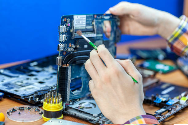 istock the concept of computer hardware, mobile phone, electronic, repairing, upgrade and technology, vacuum cleaning of the cooler from dust 1302978186