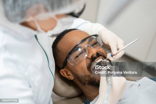 Dentist Using Dental Drill Stock Photo - Download Image Now - Dentist, Dental Health, Dental Equipment