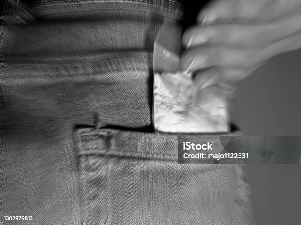 Man Puts Cocaine Powder Bag Into Back Jeans Pocket Stock Photo - Download Image Now - Abuse, Addiction, Adult