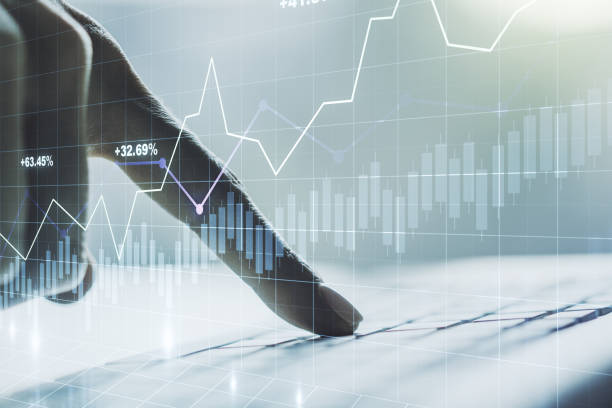 istock Multi exposure of abstract creative financial graph with hand typing on laptop on background, forex and investment concept 1302981535