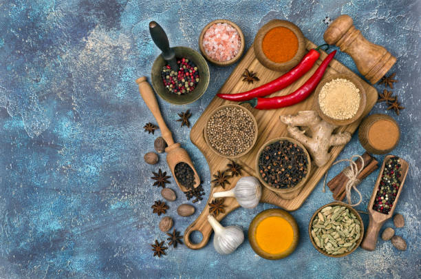 istock Spices and condiments for cooking on colorful background 1302981537