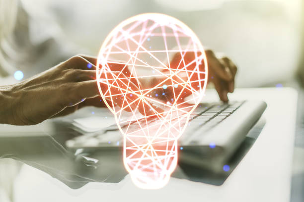 istock Creative idea concept with light bulb illustration and hands typing on laptop on background. Multiexposure 1302981580