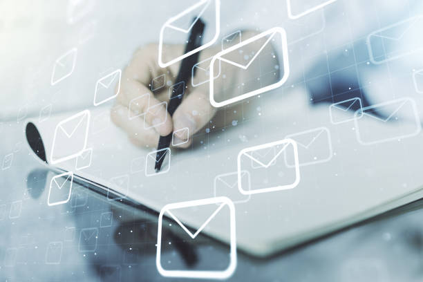 istock Creative concept of postal envelopes illustration with hand writing in notebook on background. Email and communications concept. Multiexposure 1302981672