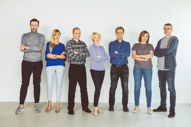 istock Portrait of confident people against white wall 1302982333