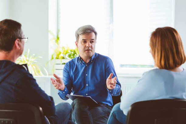 istock Psychotherapist talking with troubled couple 1302983921