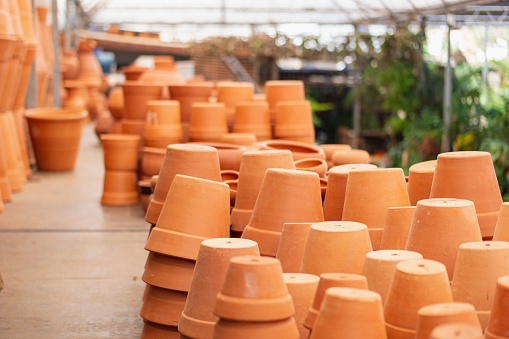 Clay pots of various shapes and sizes for flowers and garden plants for sale on open market