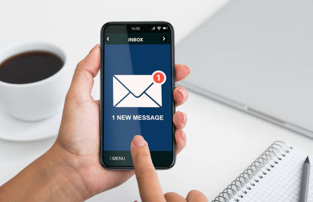 istock Phone With New E-Mail Message Notification In Females Hands, Closeup 1302985717