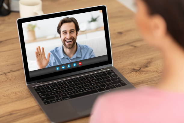 istock Young lady communicating to her boyfriend on video chat, using laptop computer for remote conversation at home 1302986450