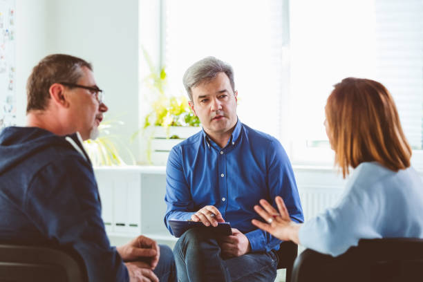 istock Psychotherapist talking with troubled couple 1302987047
