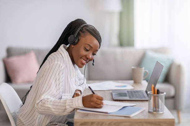 istock Joyful african american woman attending online course 1302987874