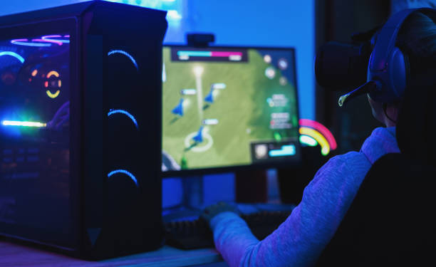 istock Girl gamer playing at strategy game online using virtual reality head set - Young people having fun with technology trends concept - Focus on headphones 1302987904