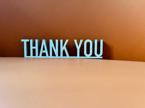 istock Short phrase Thank you on orange background 1302988316