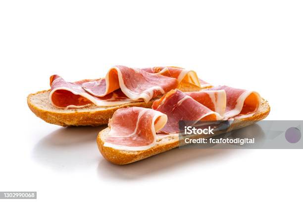 Cured Serrano Ham On Toast Montadito De Jamon Serrano Isolated On White Background Stock Photo - Download Image Now