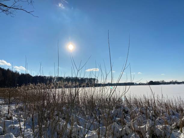 istock lake covered with ice and covered with snow 1302992586
