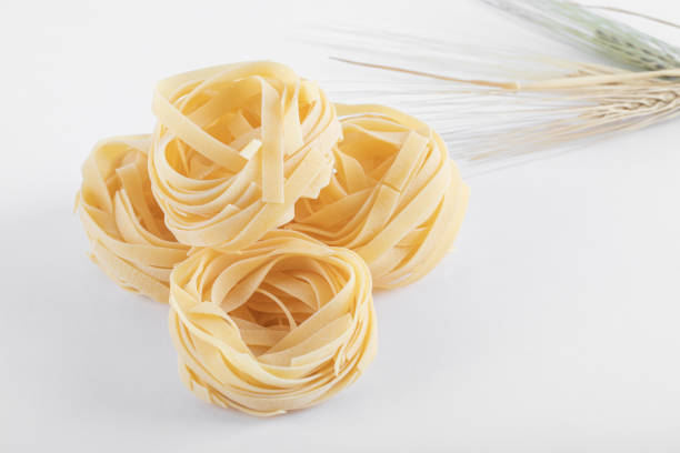 istock Close up of uncooked italian egg pasta nests 1302993107