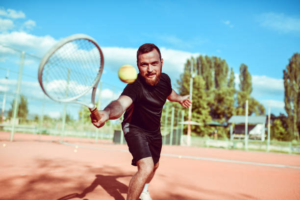 Handsome Tennis Player Returning The Ball Just In Time