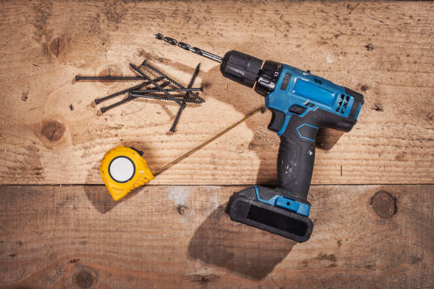 istock Set of work tools on wooden plank on construction site 1302996063