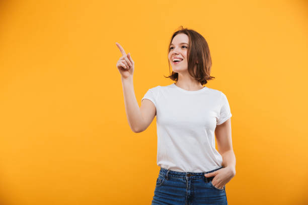 istock Excited young woman showing copyspace looking aside. 1302997074