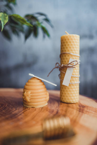 Candles from on a wooden table. Beeswax candles on a wooden table. beeswax photos stock pictures, royalty-free photos & images