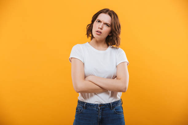 istock Displeased young lady standing isolated 1302999101