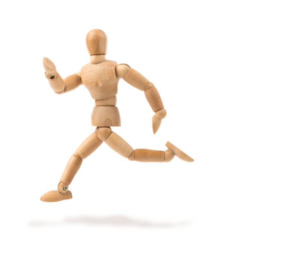 istock Wooden mannequin runs and turns around 1303000825