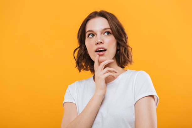 istock Emotional cute young woman standing isolated 1303000898