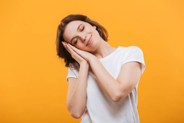 istock Sleeping cute young lady standing isolated 1303002944