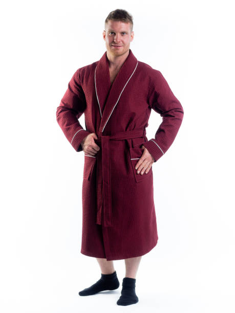 istock strong man in a Bathrobe on an isolated white background with a smile on his face. 1303003717