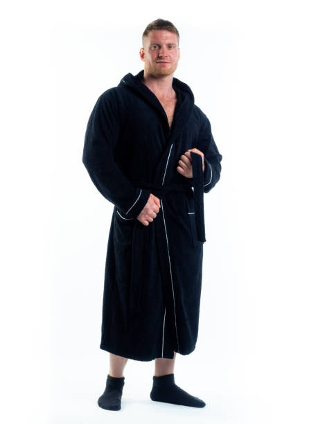 istock strong man in a Bathrobe on an isolated white background with a smile on his face. 1303003720