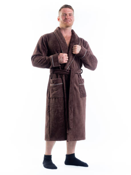 istock strong man in a Bathrobe on an isolated white background with a smile on his face. 1303003723