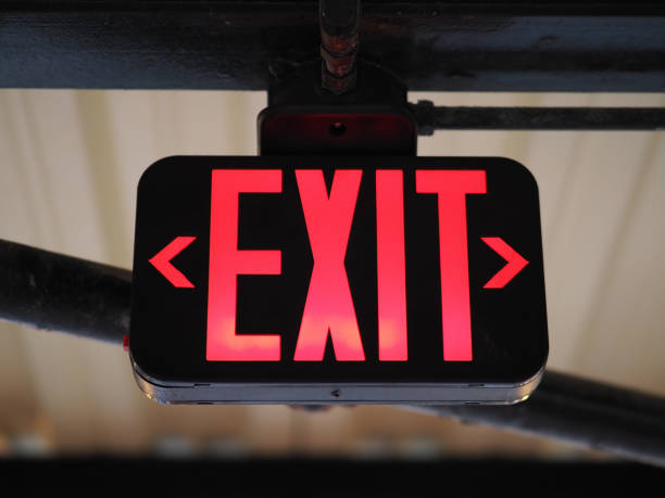Image of a red emergency exit sign. A sign marking the direction of the emergency Exit. exit sign photos stock pictures, royalty-free photos & images