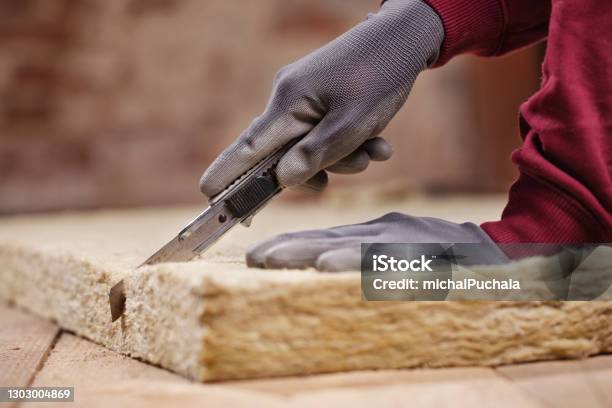 Cutting Mineral Wool With Utility Knife Stock Photo - Download Image Now - Mineral Wool, Insulation, Wool